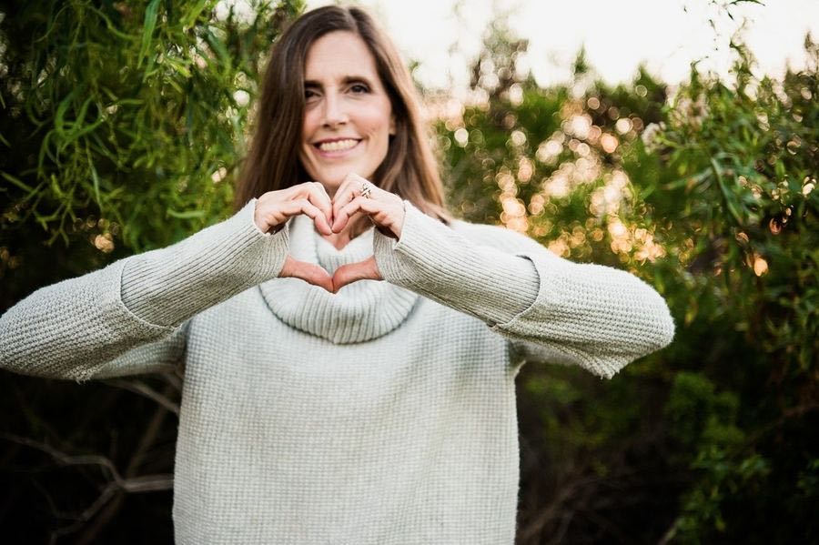 Heart hands, representing caregiver support
